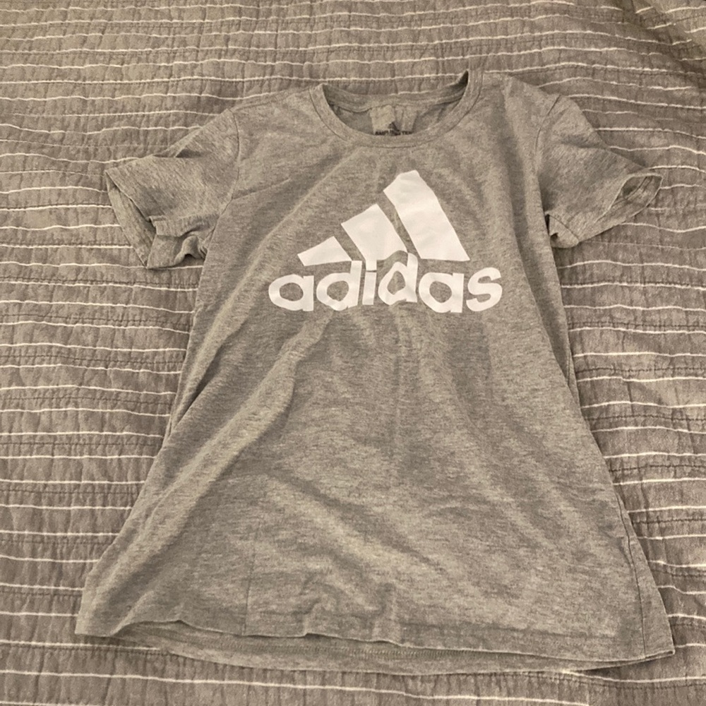 This is a light gray adidas tee shirt